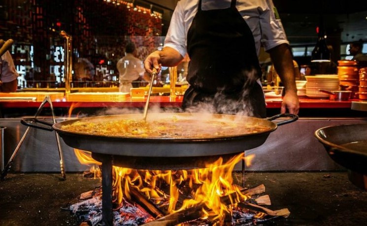 Image of paella being cooked for Magical Dining