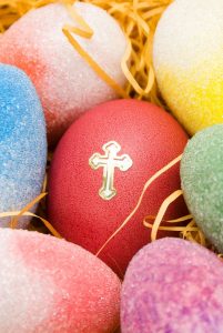 Image of coloured easter eggs with a gold cross