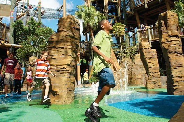 Kids enjoying Universal Studios' Jurassic World area.