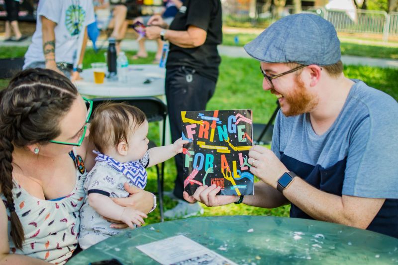 People enjoying the art work at Orlando's Fringe Festival.