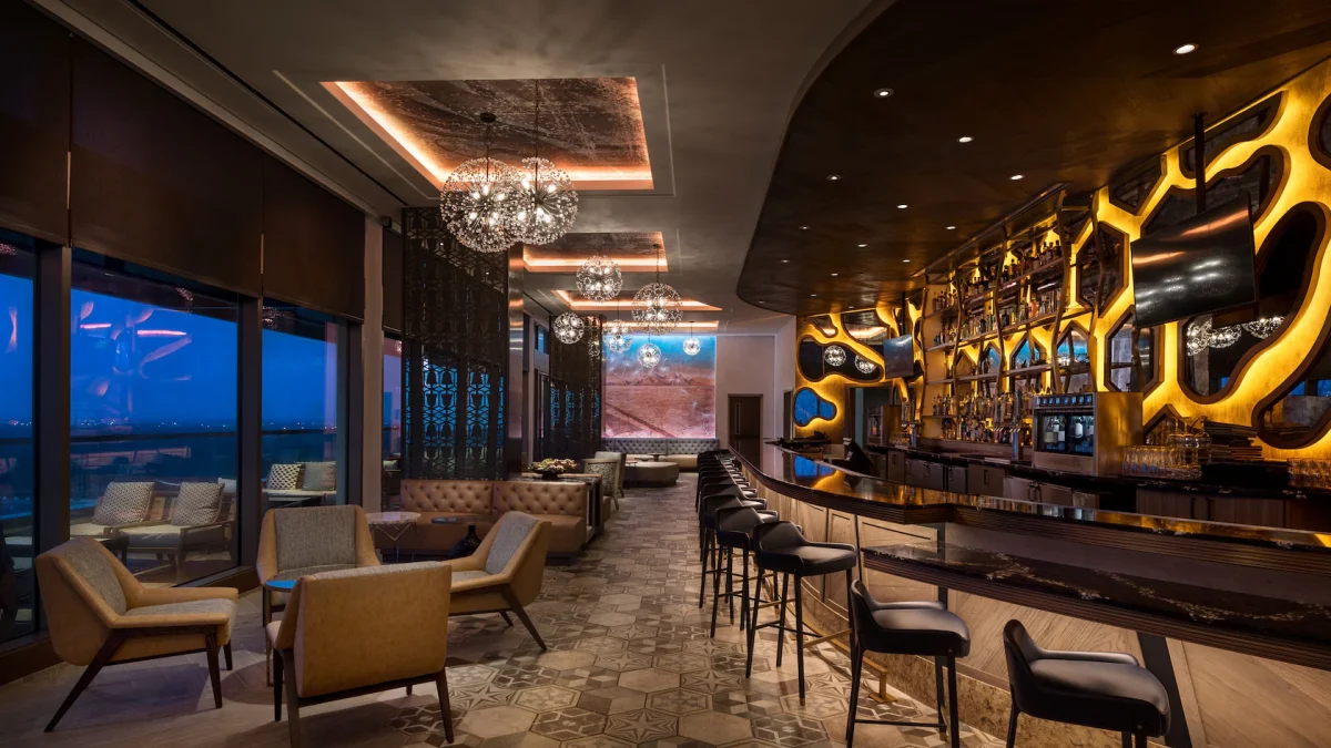 Dahlia Lounge, showing the bar and grill with night time view of Orlando.