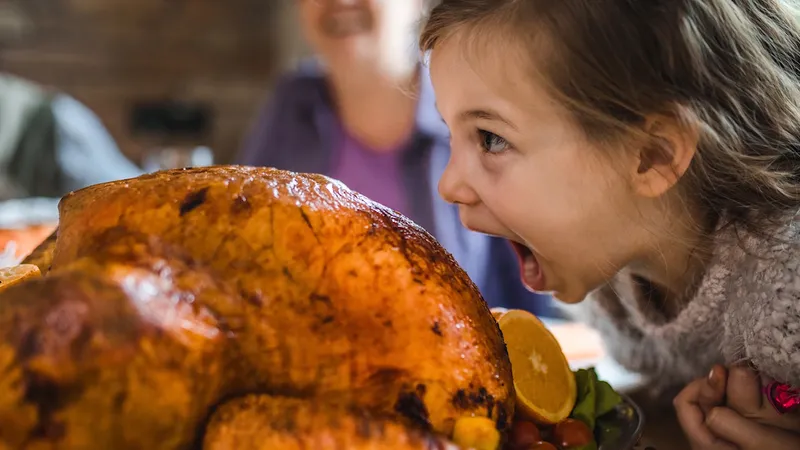 Family about to enjoy a turkey on thanksgiving 