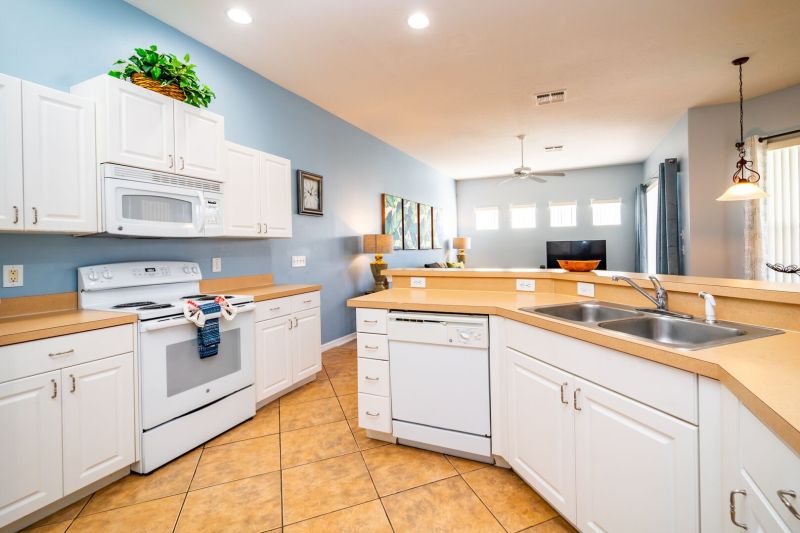 Fully equipped kitchen inside a rental near Disney managed by Orlando rent a villa 