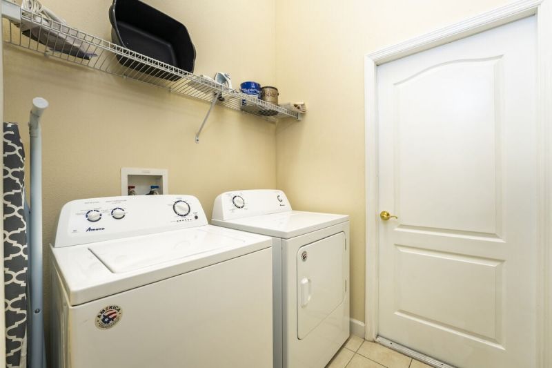 Laundry room inside a vacation rental near Disney managed by Orlando rent a villa  