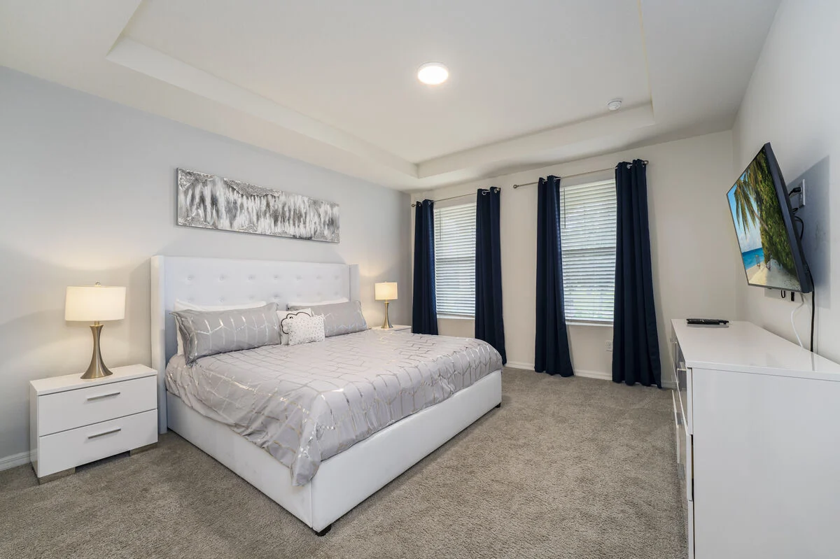 King bedroom with en-suite bathroom and TV at S1949TPC - Tropical Delight vacation home