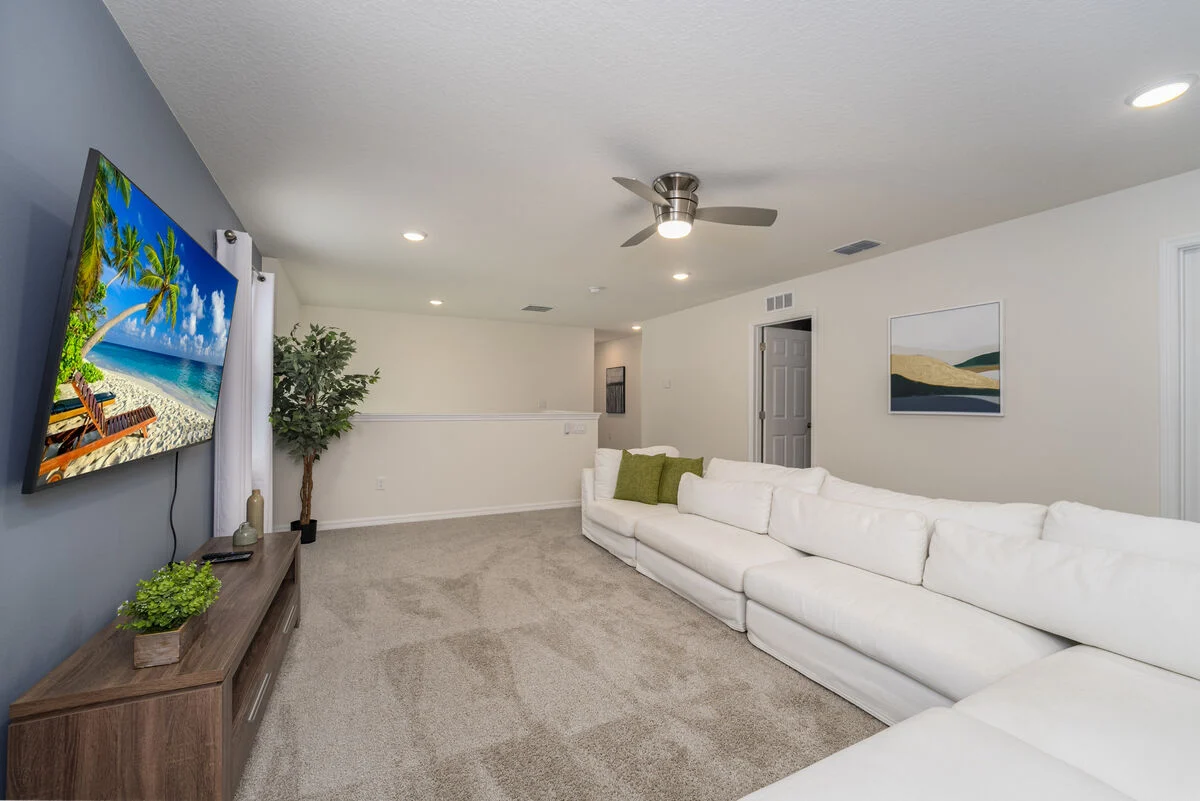Upstairs loft with sectional seating and smart TV at S1949TPC - Tropical Delight